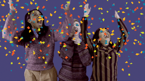 three girls celebrating with confetti